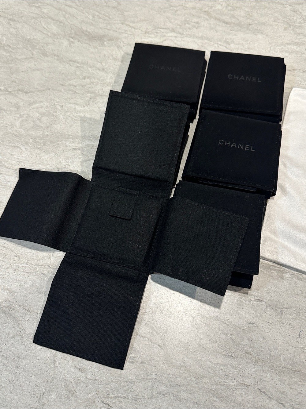 6 CHANEL Black Velvet Pouches And White Cloth